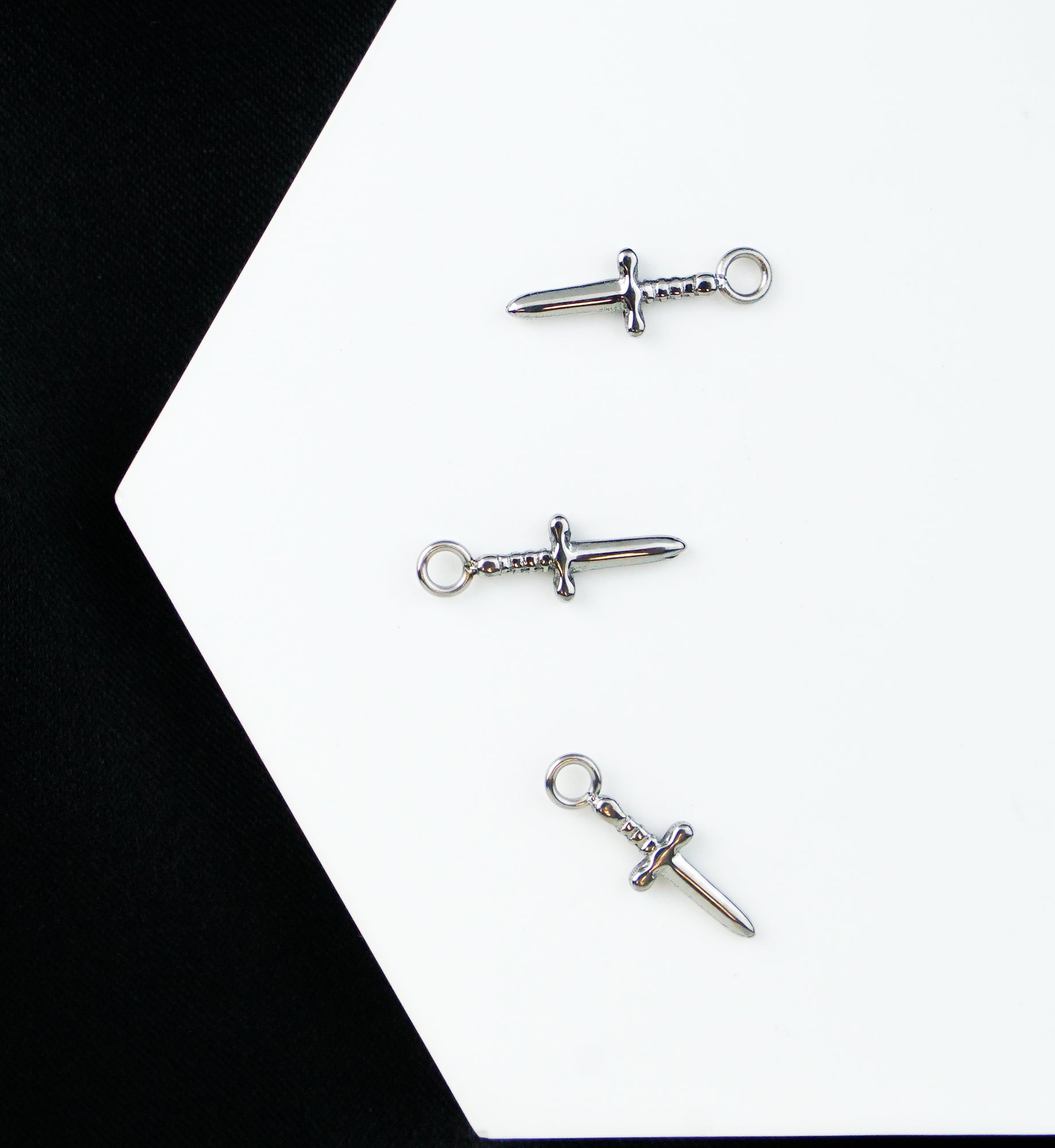 Dagger Titanium Charm