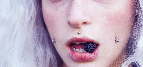 How to Trend Fashion Forward with a Cheek Piercing