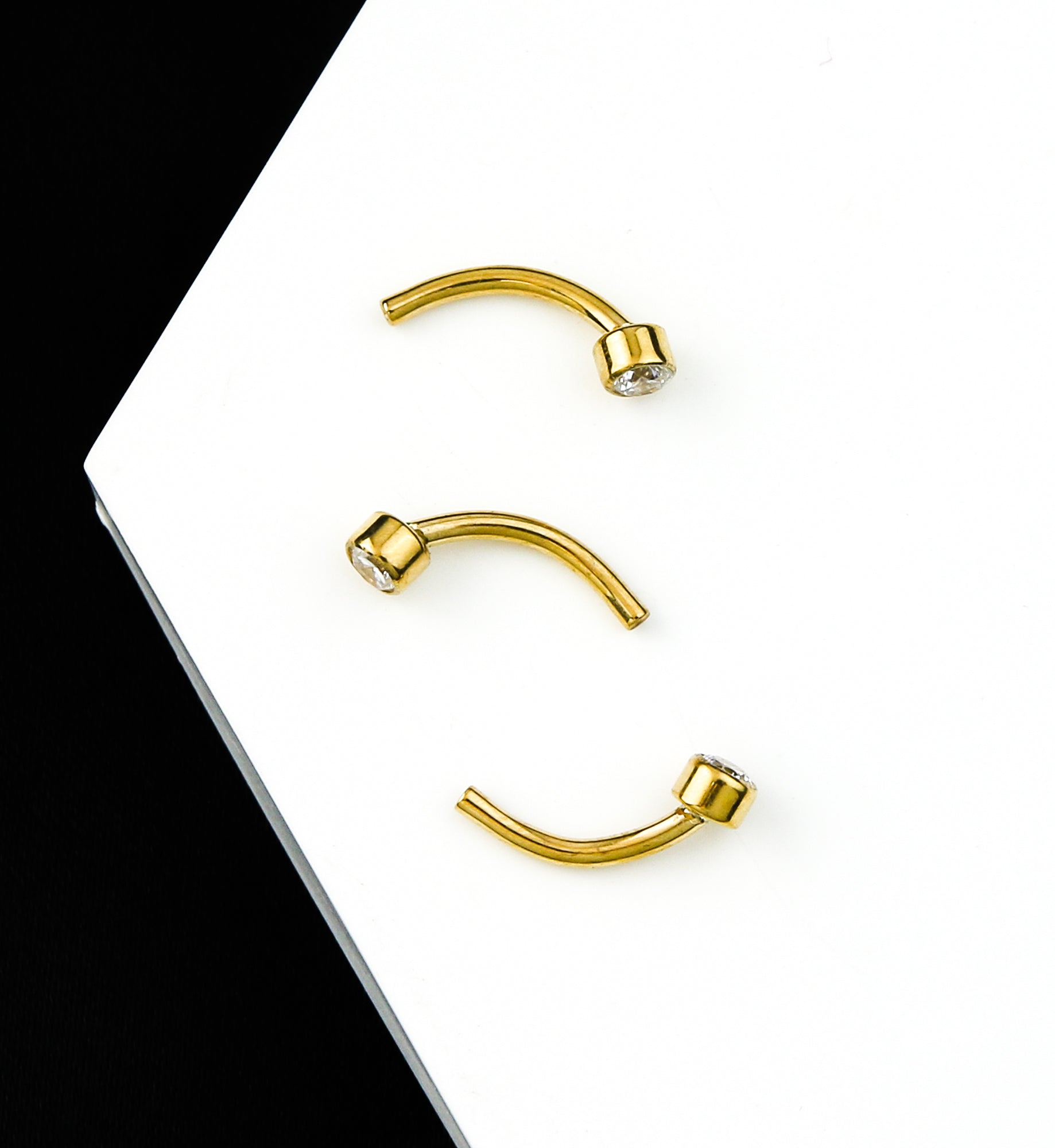 24kt-gold-pvd-bezel-clear-cz-titanium-threadless-curved-barbell